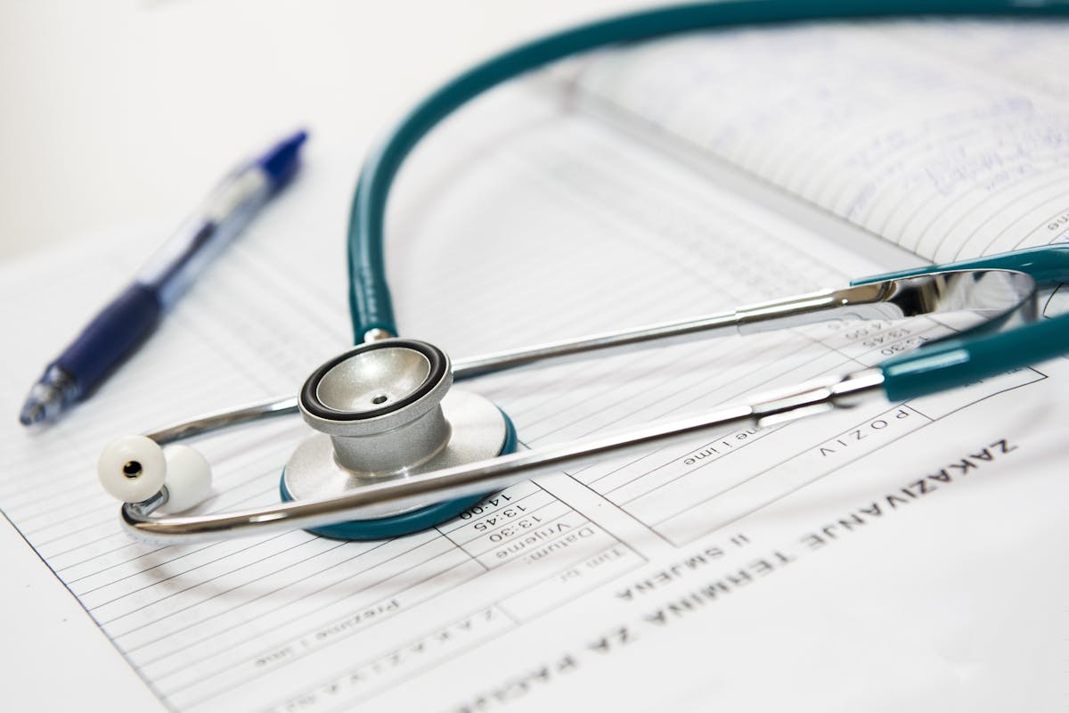 A healthcare professional discussing results on a tablet with a patient.