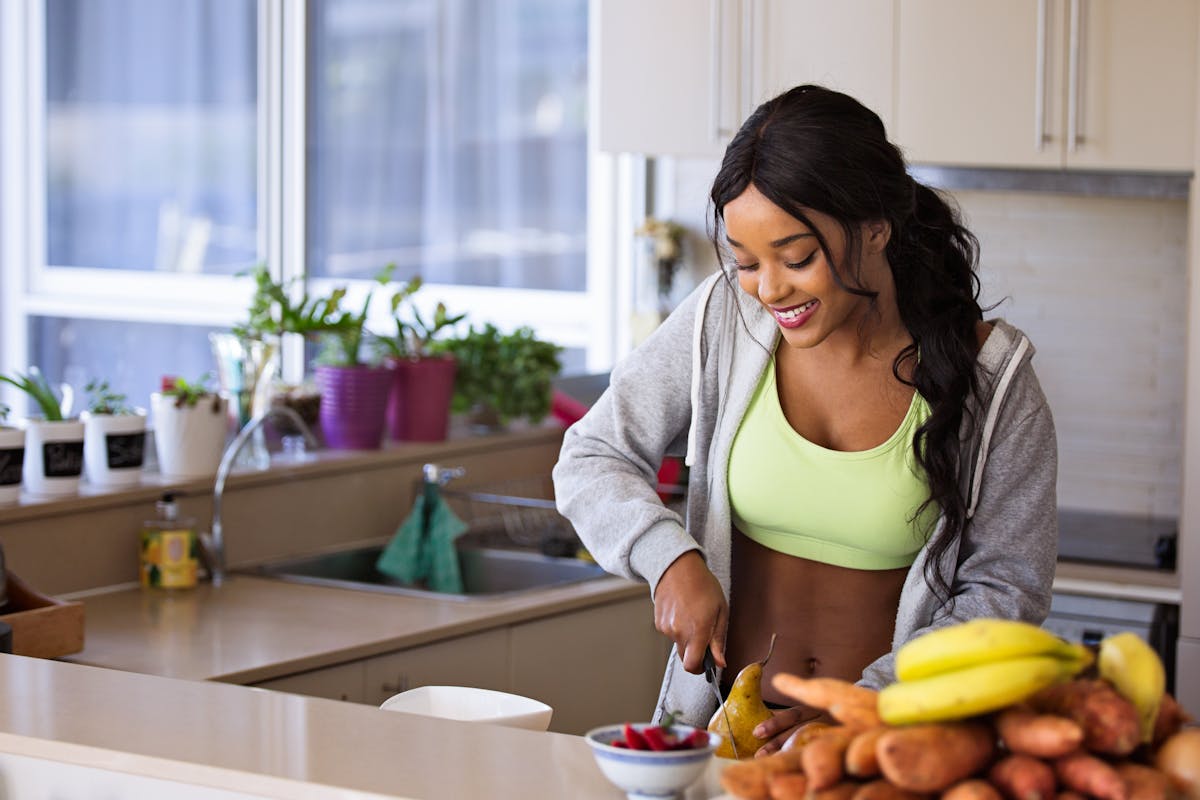 A healthy meal with fresh salmon, vegetables, and a measuring tape, symbolizing a balanced approach to weight.