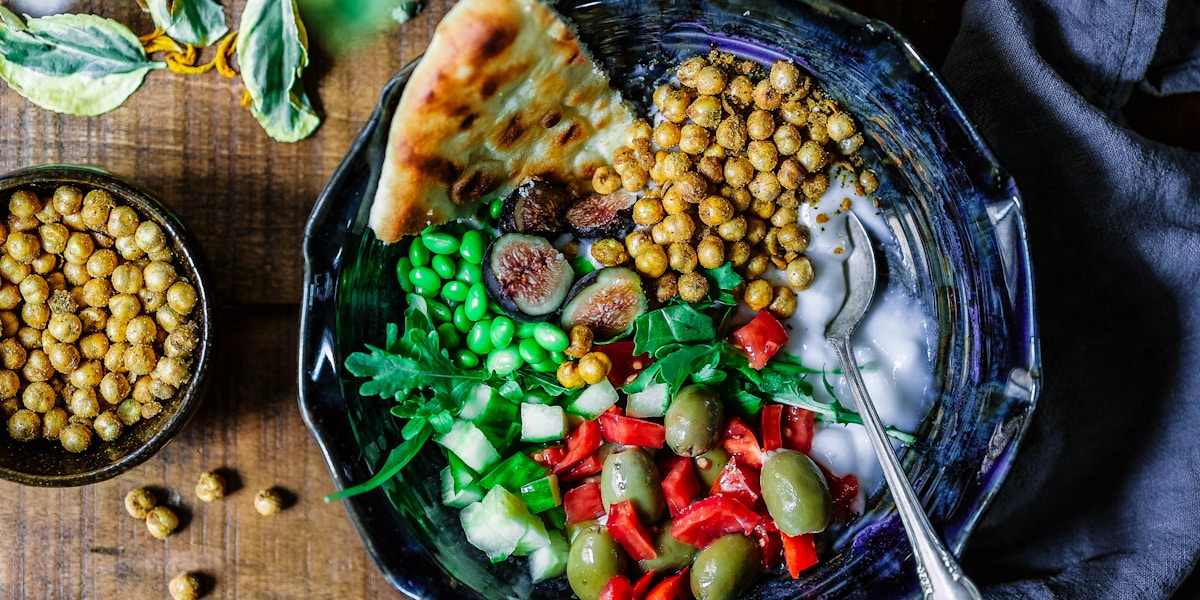 A variety of healthy foods like fruits and vegetables arranged beautifully.